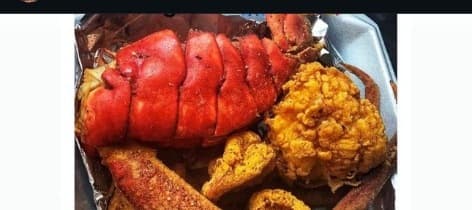 Seafood platter with lobster, shrimp, and fried fish